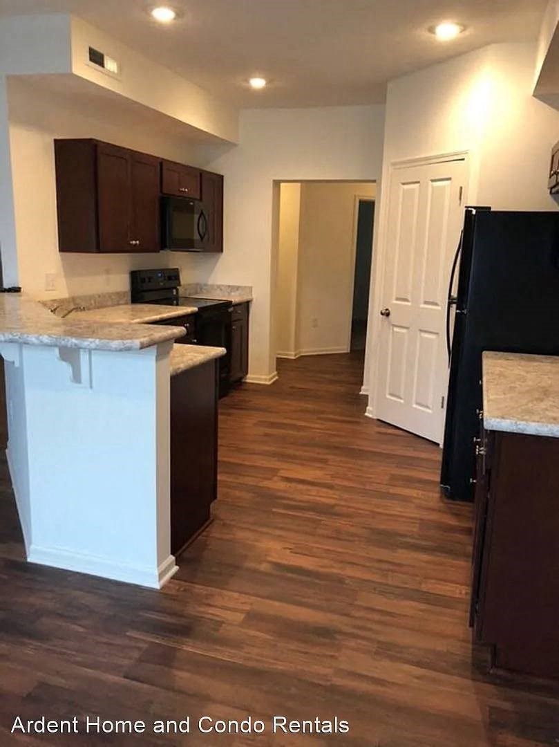 a view of a kitchen with a wood floor