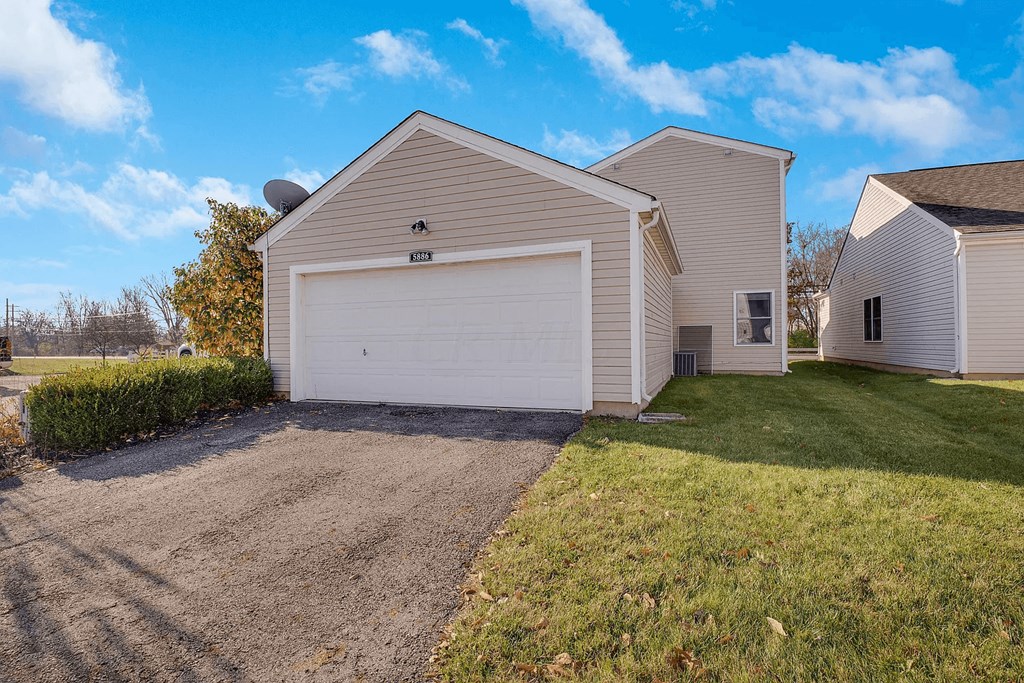 A house with a garage and a driveway.