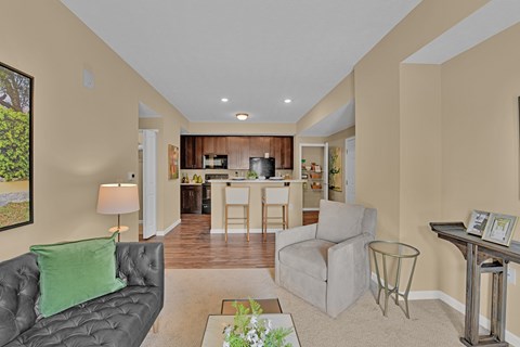 A living room with a grey couch and a coffee table.