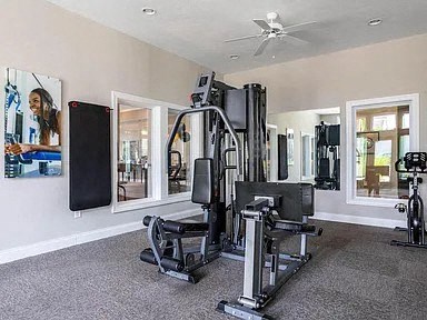 the home gym has a lot of equipment in it