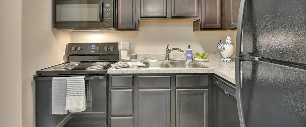 a kitchen with stainless steel appliances and a sink