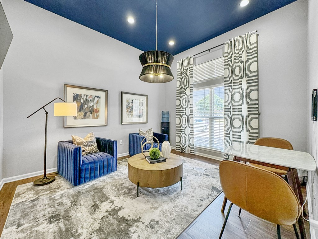 a living room with a couch and a table at 92West, West Des Moines, 50266  