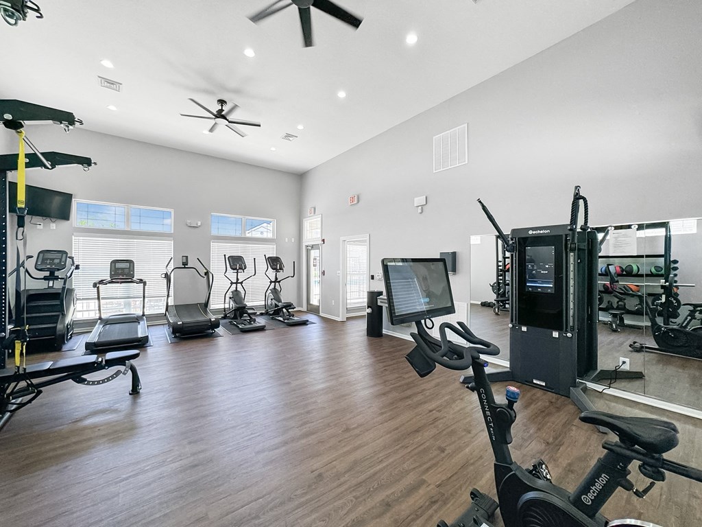 the residence apartments fitness room with weights and cardio equipment at 92West, West Des Moines, IA  