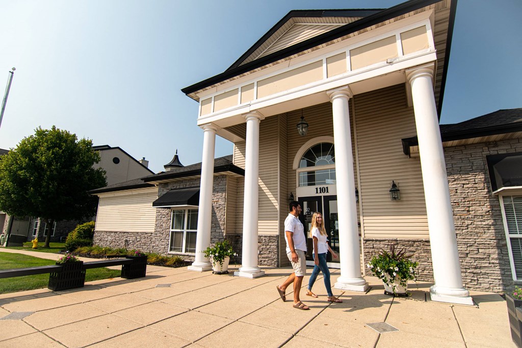 people walking in front of a house at 92West, West Des Moines Iowa  