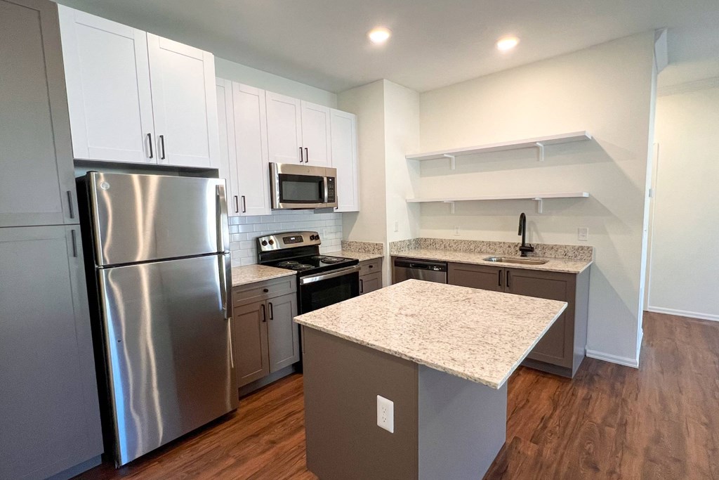 a kitchen with stainless steel appliances and granite counter tops at 92West, West Des Moines, 50266  