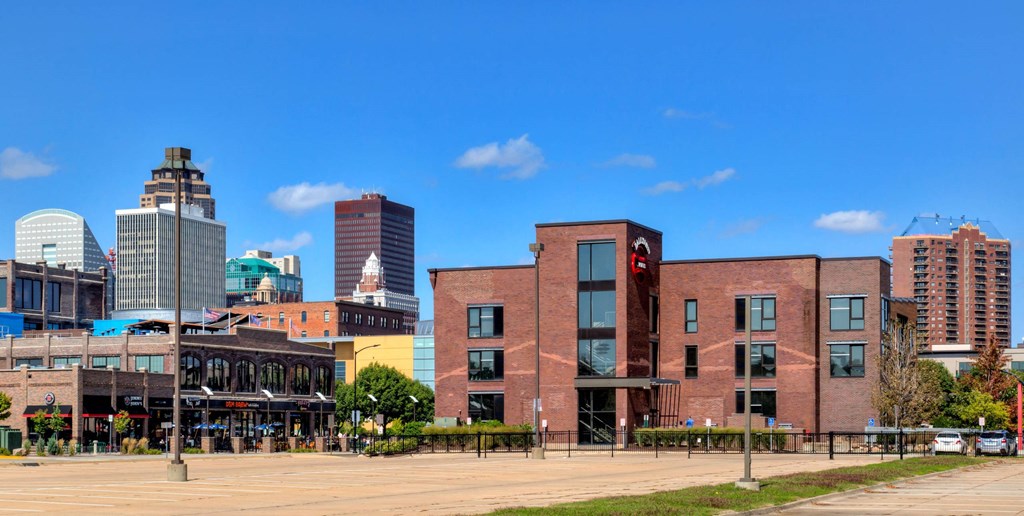 a view of the city from a parking lot at Ballyard Lofts, Indigo Living, IA, 50309