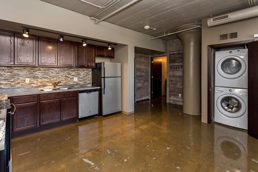 Kitchen with a washing machine and a washer in it at Ballyard Lofts, Indigo Living, IA, Iowa , 50309