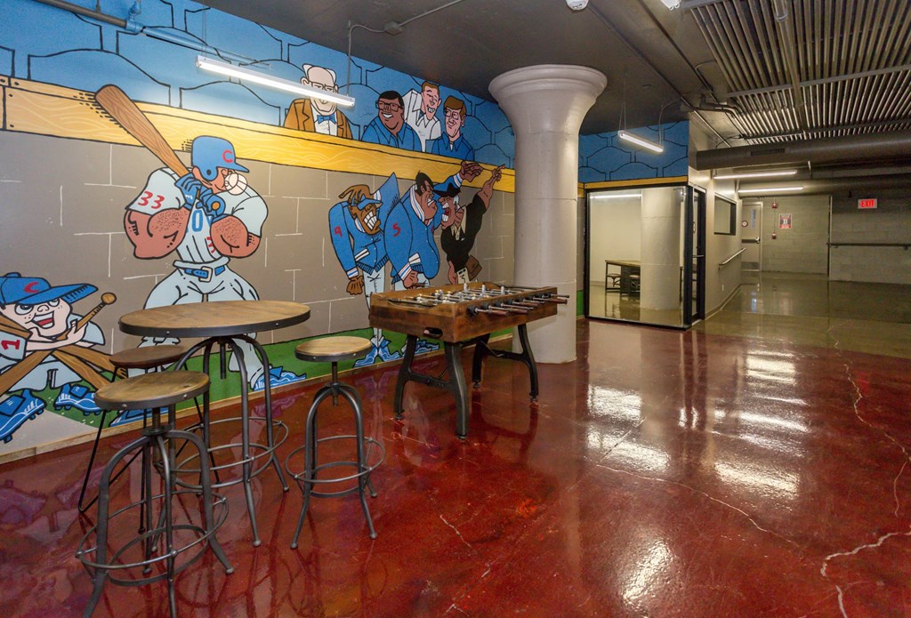 Clubhouse with a foosball table at Ballyard Lofts, Indigo Living, 50309