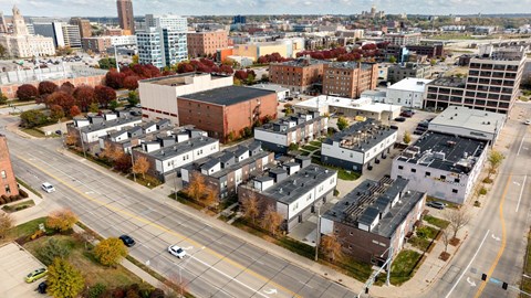A city street with cars and buildings.