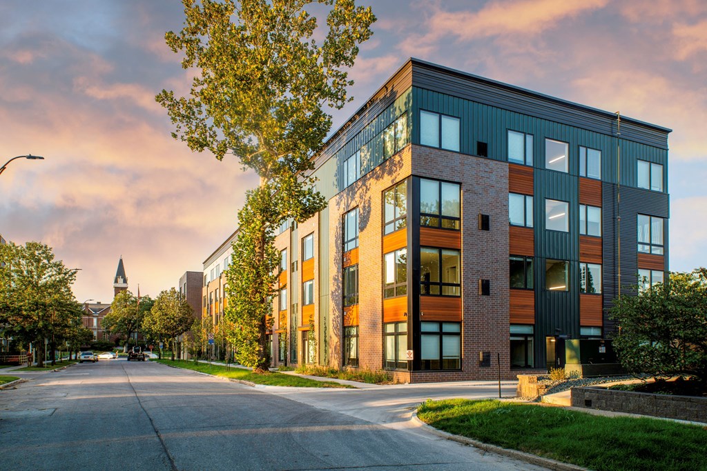 a modern building with a street in front of it at Canary Lofts, Des Moines