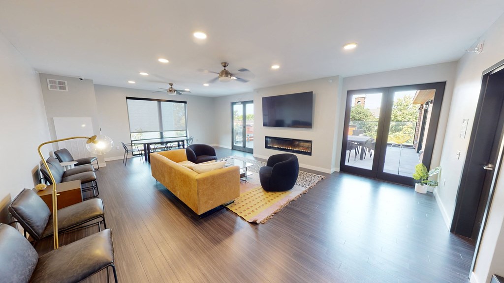 a living room with a couch and a television at Canary Lofts, Iowa, 50311