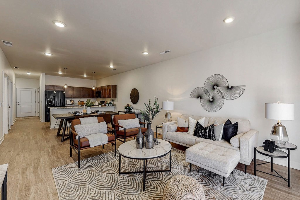a living room with a couch and a table at Centennial Crossing, Waukee