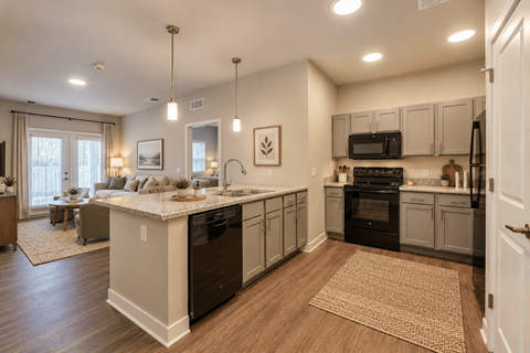 A modern kitchen with dark wood floors and white countertops.