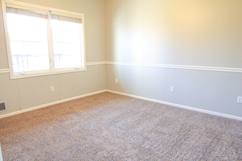 a room with a carpeted floor and two windows at Diamond Brooke, West Des Moines, IA 50266  
