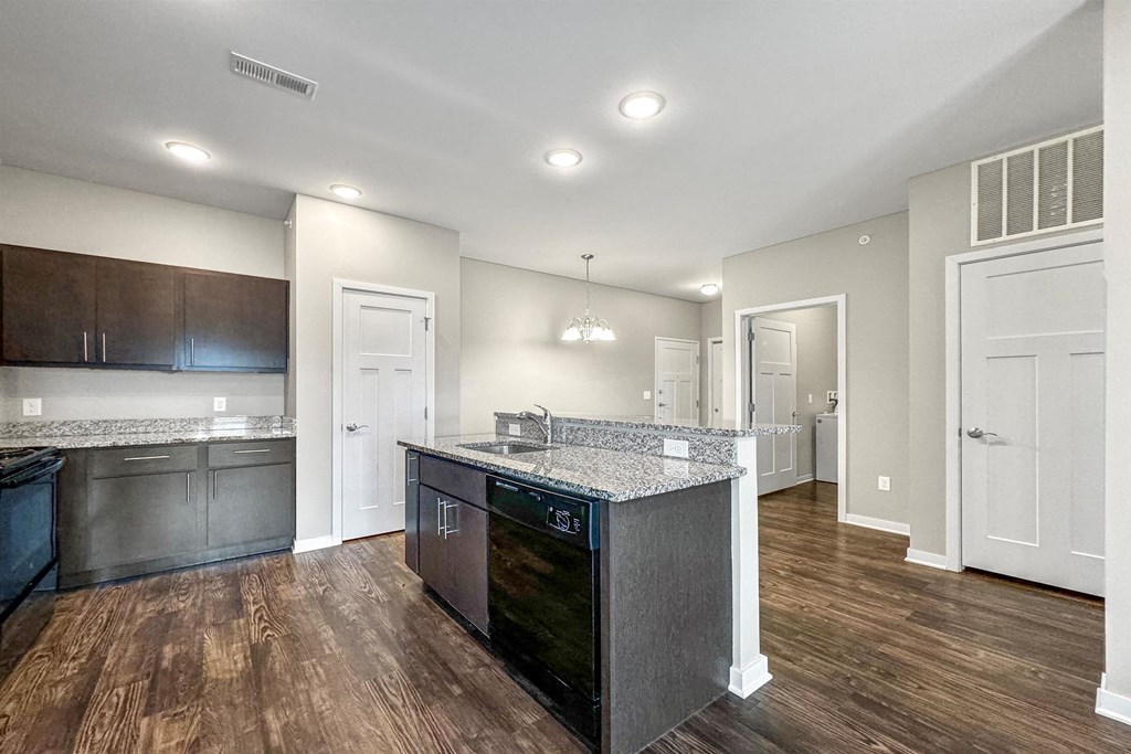 a kitchen with a counter top and a sink at The Barclay Apartments, IOWA