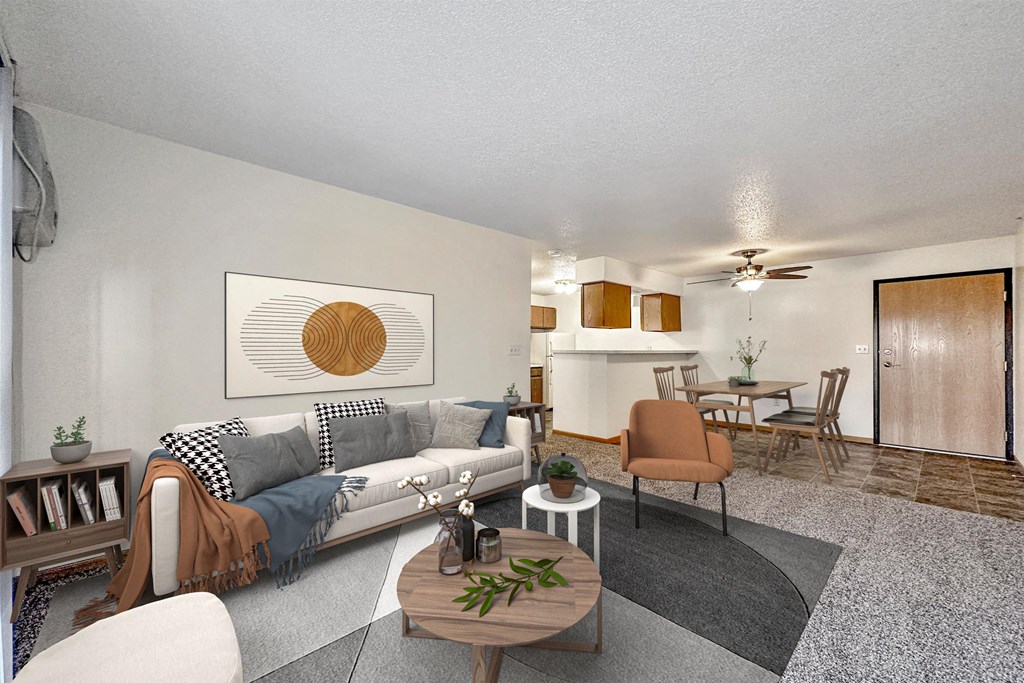 the living room of an apartment with a couch and a table at Somerset Apartments, Des Moines, Iowa