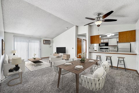 A living room with a dining table and chairs.
