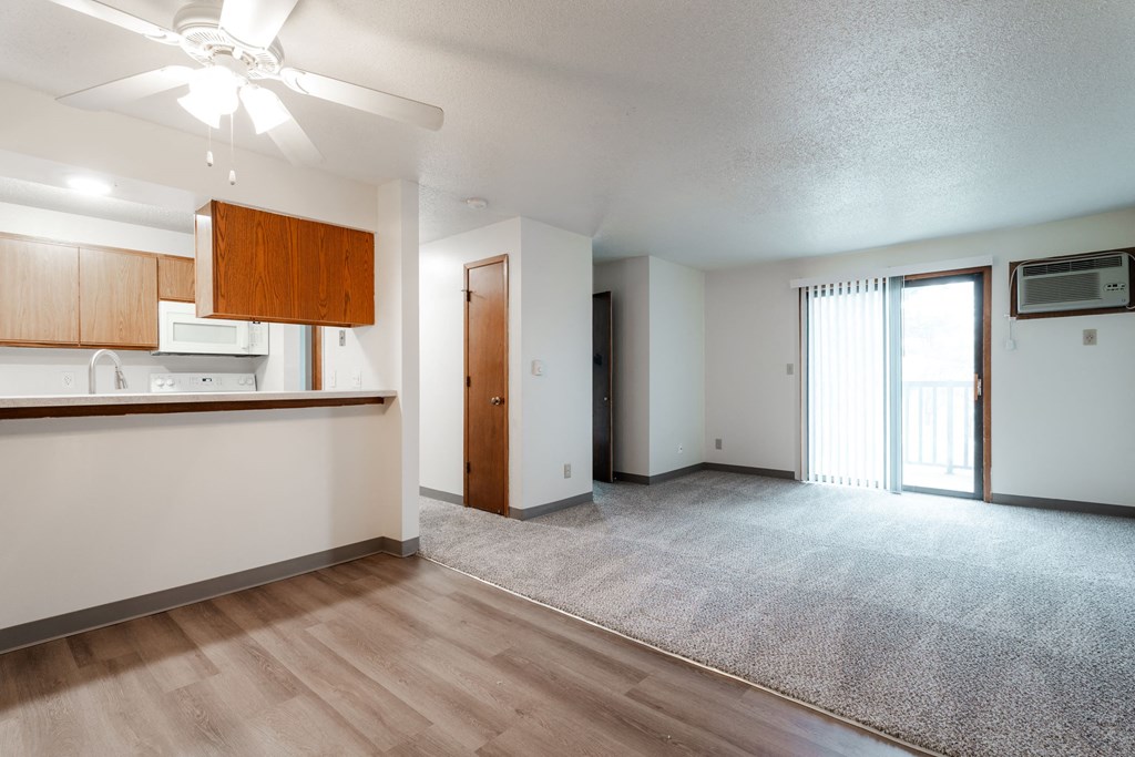 A room with a ceiling fan and a carpeted floor. at Bristol Ridge, Urbandale, 50322