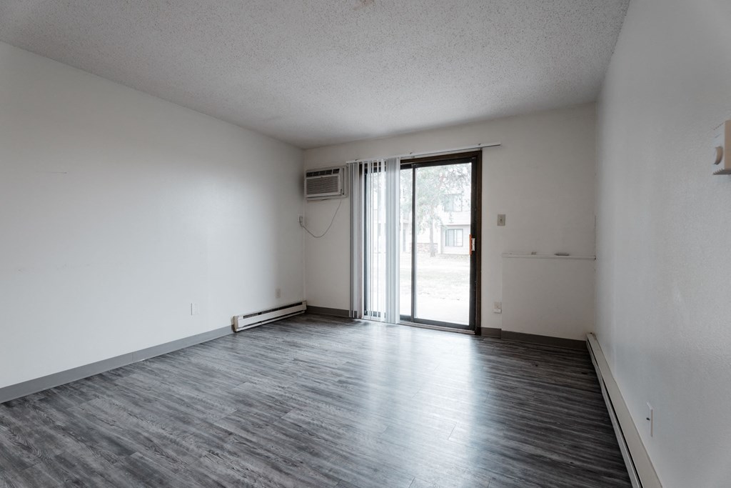 A room with a sliding glass door and a window. at Bristol Ridge, Urbandale