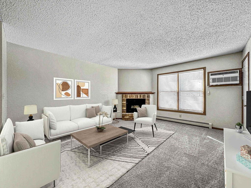 a living room with white furniture and a fireplace at Creekstone Falls, Sioux Falls, SD