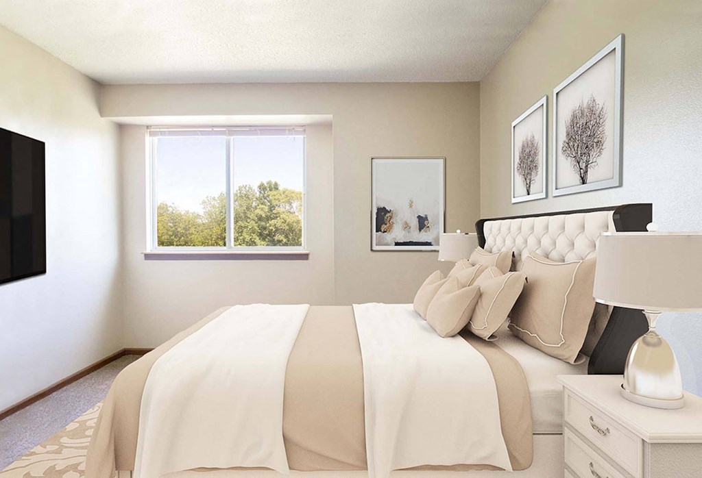 A bedroom with a large bed and a window showing trees outside. A bedroom with a large bed and a window showing trees outside at Hunters Run Apartments, Newton, Iowa