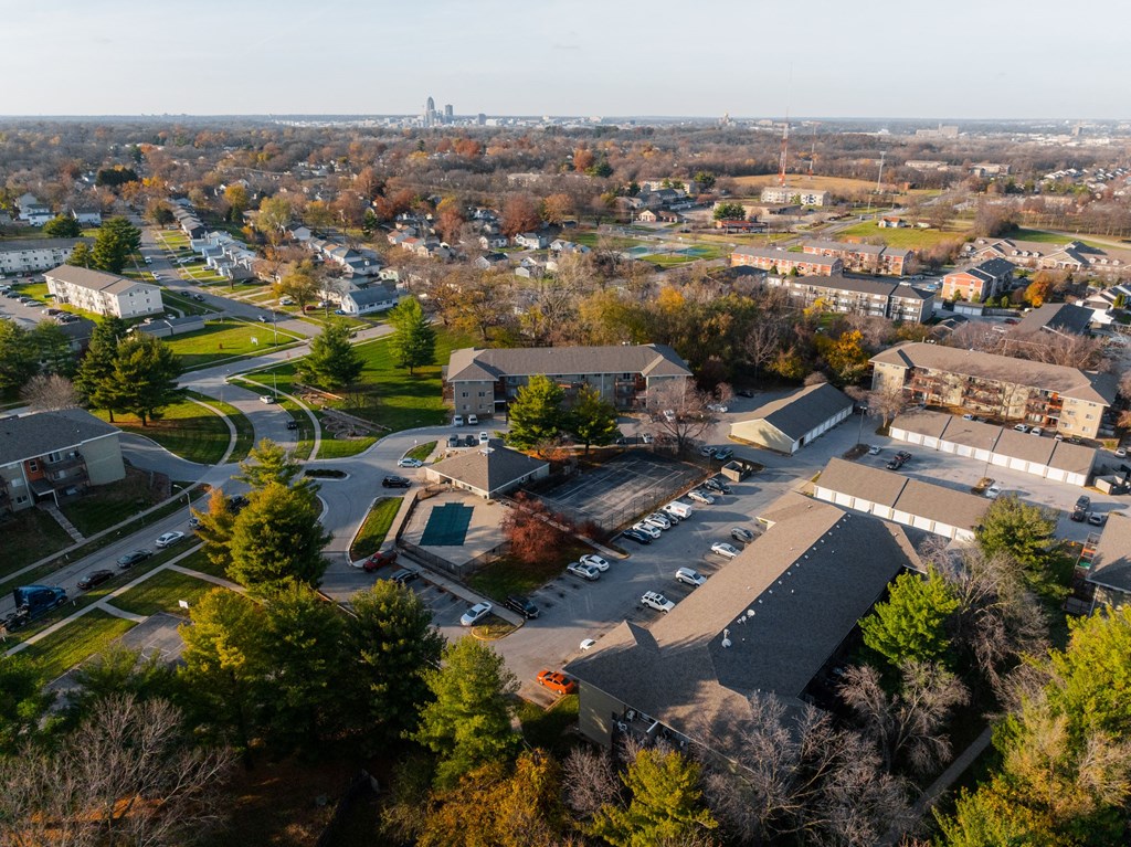 A bird's eye view of a residential area with houses and trees. at Rosemont Place Apartments, Des Moines, IA, 50320