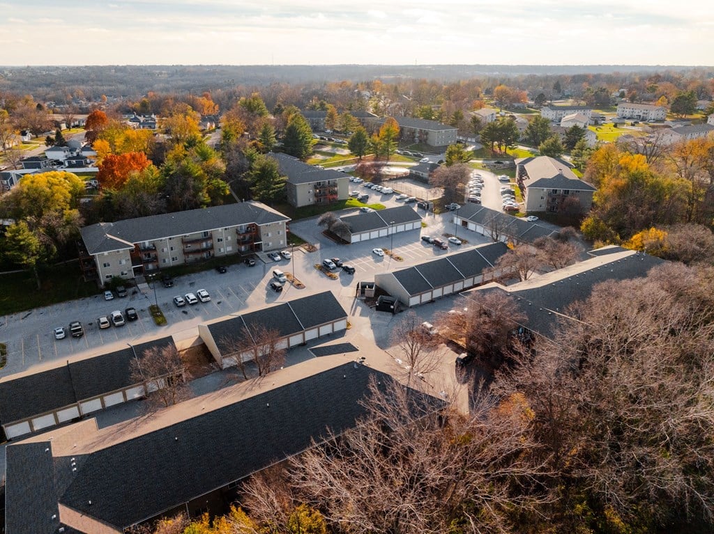 A bird's eye view of a residential area with houses and trees. at Rosemont Place Apartments, Iowa, 50320