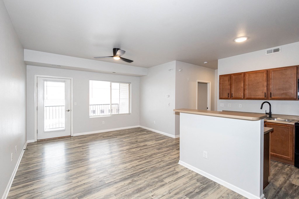 A kitchen with a wooden cabinets at Meadowlark Place Apartments, Grimes