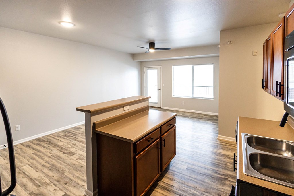 A kitchen with a sink, stove, and cabinets at Meadowlark Place Apartments, Georgia