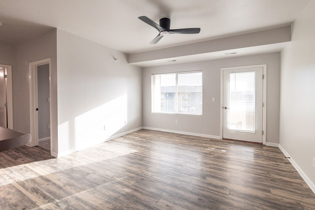 An empty living room at Meadowlark Place Apartments, Grimes, IA
