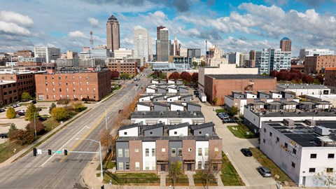 A cityscape with a mix of residential and commercial buildings.