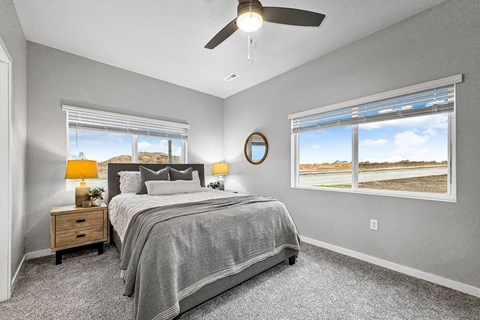 a bedroom with a bed and a ceiling fan at Converge NW, Waukee, 50263  