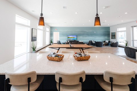 a large dining room with tables and chairs and a television in the background at Converge NW, Waukee, 50263  