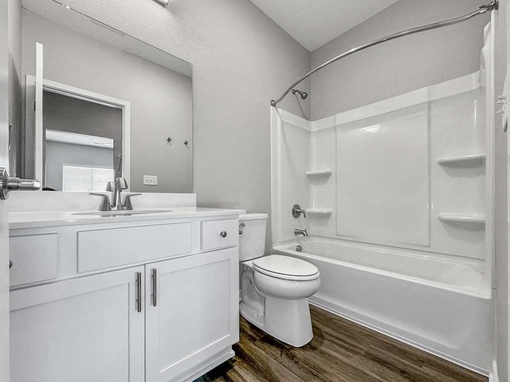 a bathroom with a sink toilet and shower at Rialto Townhomes Apartments, Iowa, 50263