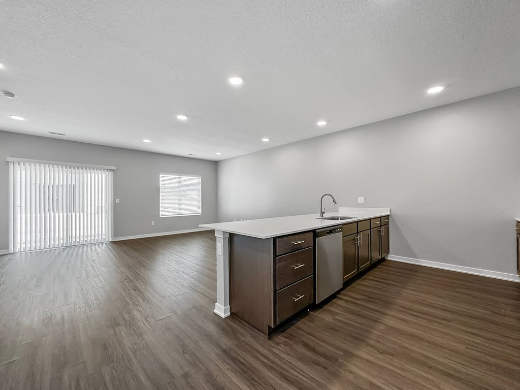 the kitchen is open to the living room and dining room at Rialto Townhomes Apartments, Waukee, 50263