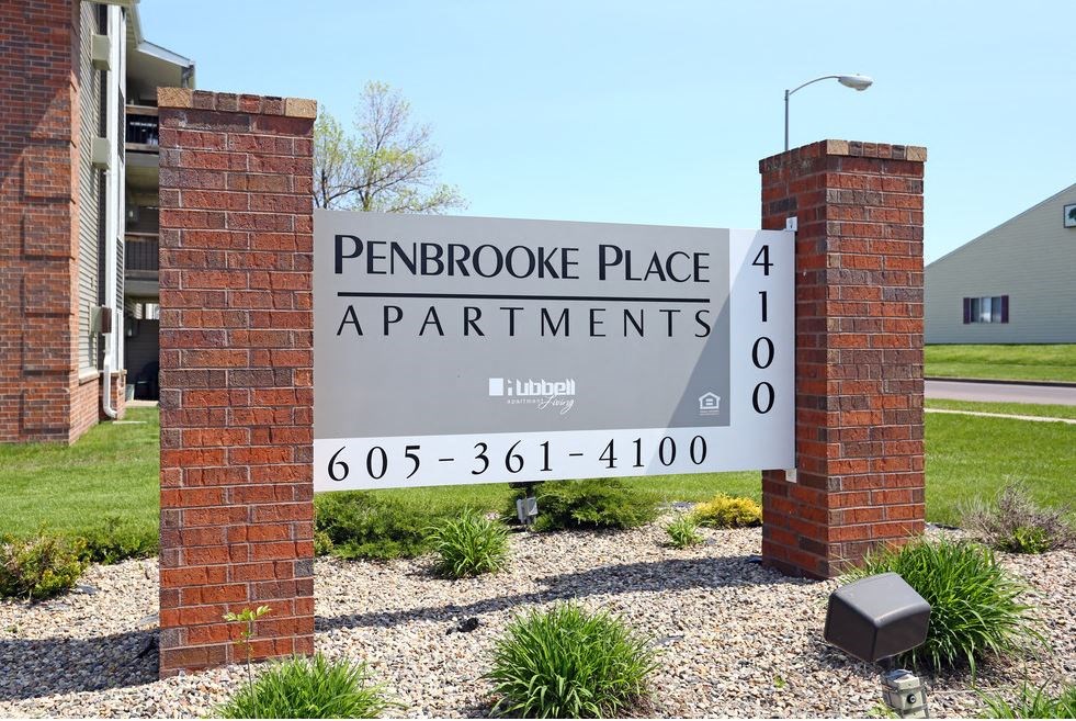 a sign for pentrooke place apartments in front of a building at Penbrooke Place Apartments, South Dakota