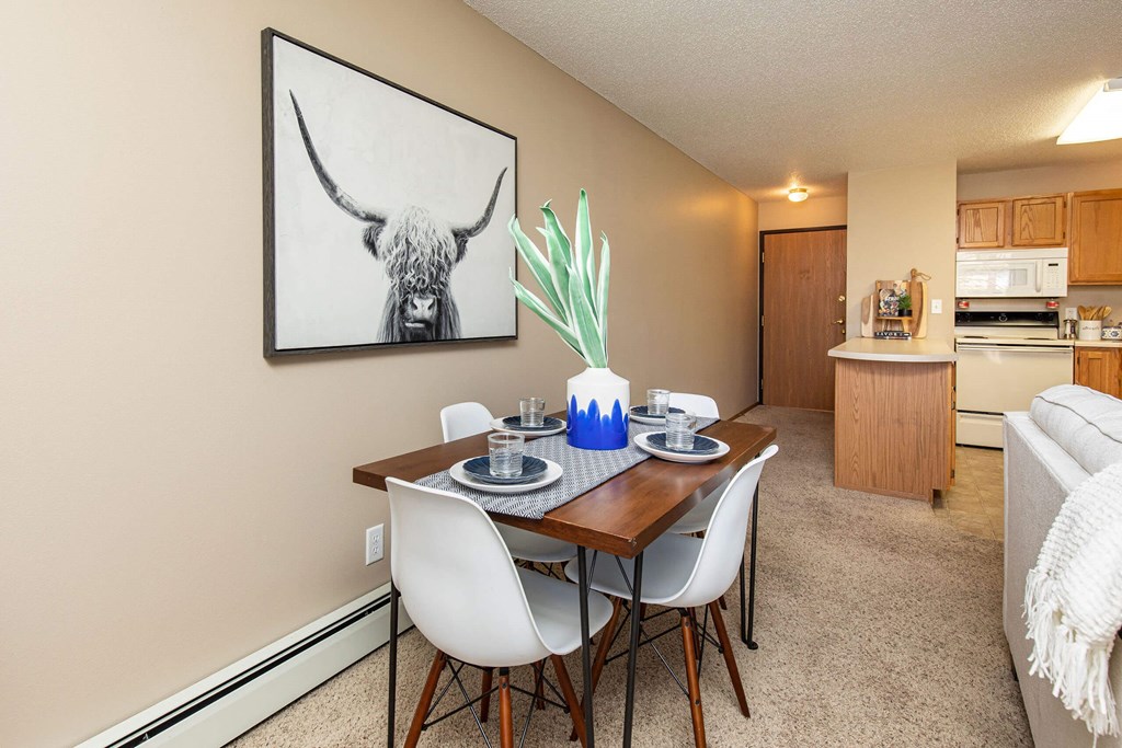 our apartments offer a dining room table with chairs and a view of the kitchen our apartments offer a dining room table with chairs and a view of the kitchen at Lake Shore Park, Iowa