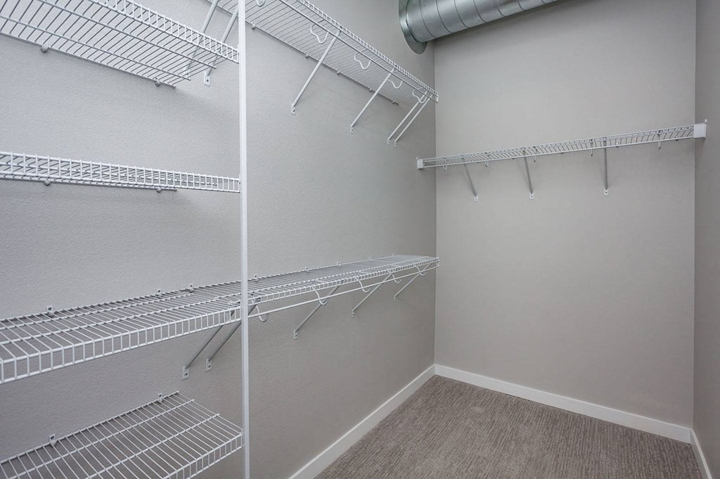 spacious closet with shelves and racks at theria apartments at Vue Apartments, Des Moines