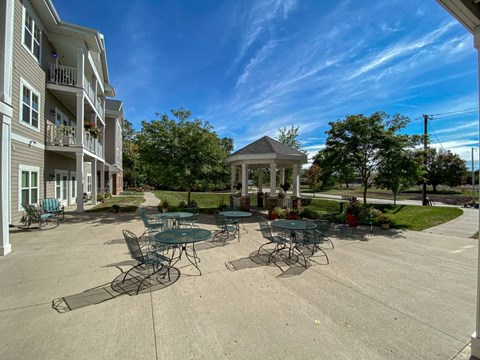 A sunny day at the outdoor seating area of a residential building.at Cornerstone Commons, Johnston, IA  