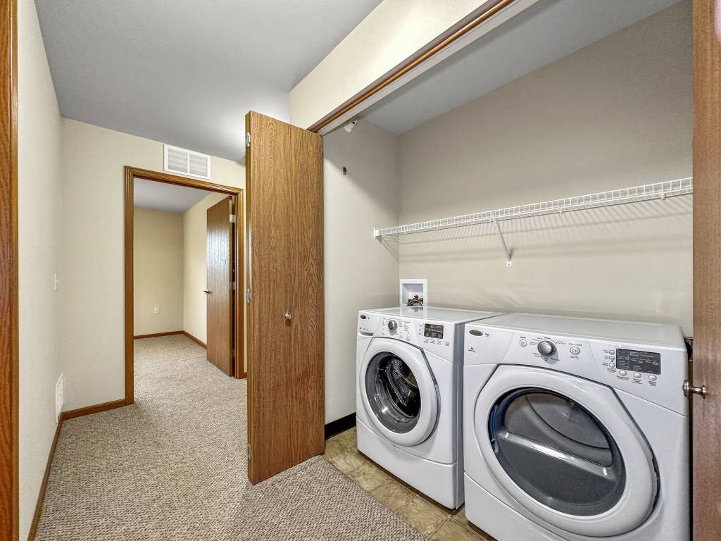 A laundry room with a washer and dryer.at Cornerstone Commons, Johnston Iowa  