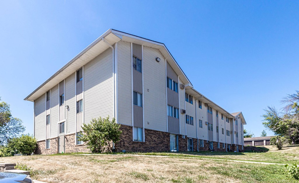 A modern building with a flat roof and a stone base A modern building with a flat roof and a stone base at The Ridges Apartments, Des Moines, IA, 50315