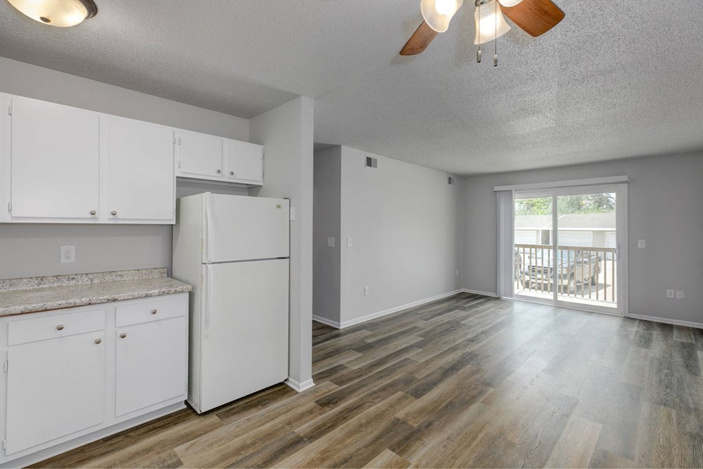 A kitchen with white cabinets and a refrigerator. A kitchen with white cabinets and a refrigerator.at Fish Creek, Norwalk Iowa
