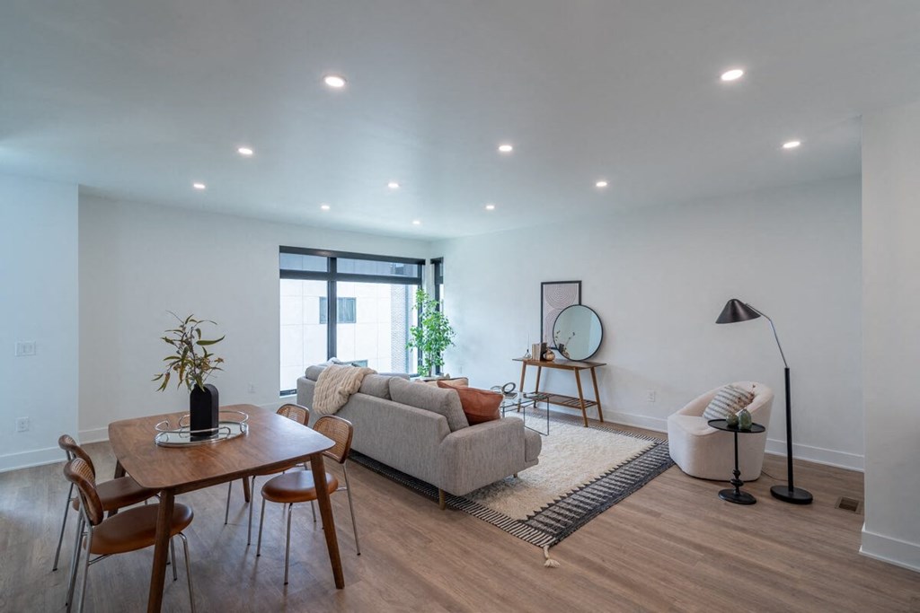 a living room with a couch and a table  at Matilda 235 Townhomes, Des Moines, 50309