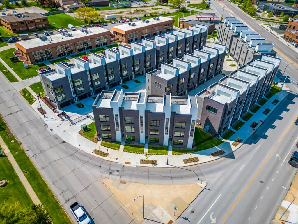 an aerial view of an apartment building with cars driving around it at Matilda 235 Townhomes, Des Moines, IA