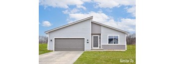 a white house with a driveway and a garage door at Two Rivers Home Rentals, Iowa 50266