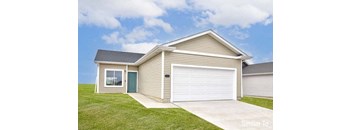 A house with a garage door and a window is shown. at Two Rivers Home Rentals, West Des Moines, 50266