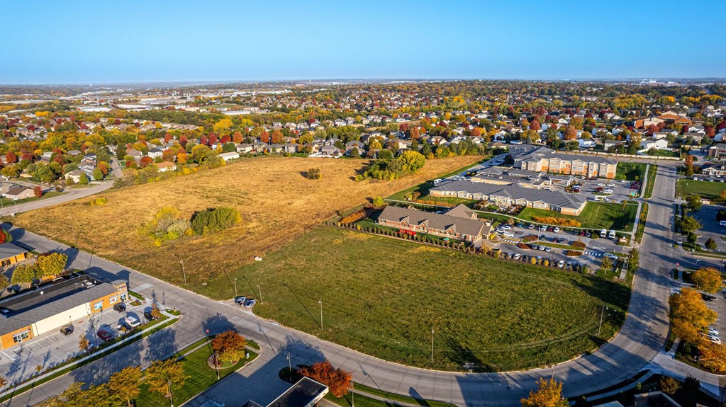 an aerial view of a field in the middle of a city at Sagebrook Apartments, La Vista, NE, 68128