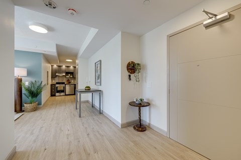 A modern kitchen with a dining table and chairs.