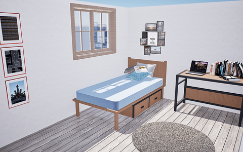 A bedroom with a bed, desk, and pictures on the wall.