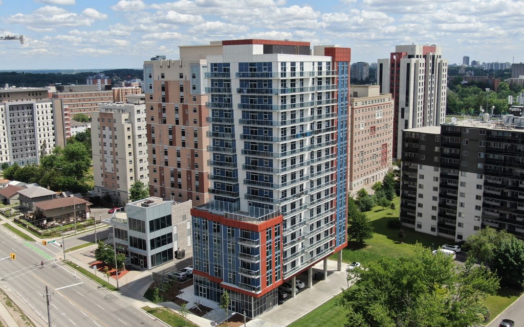 an aerial view of an apartment building in the city
